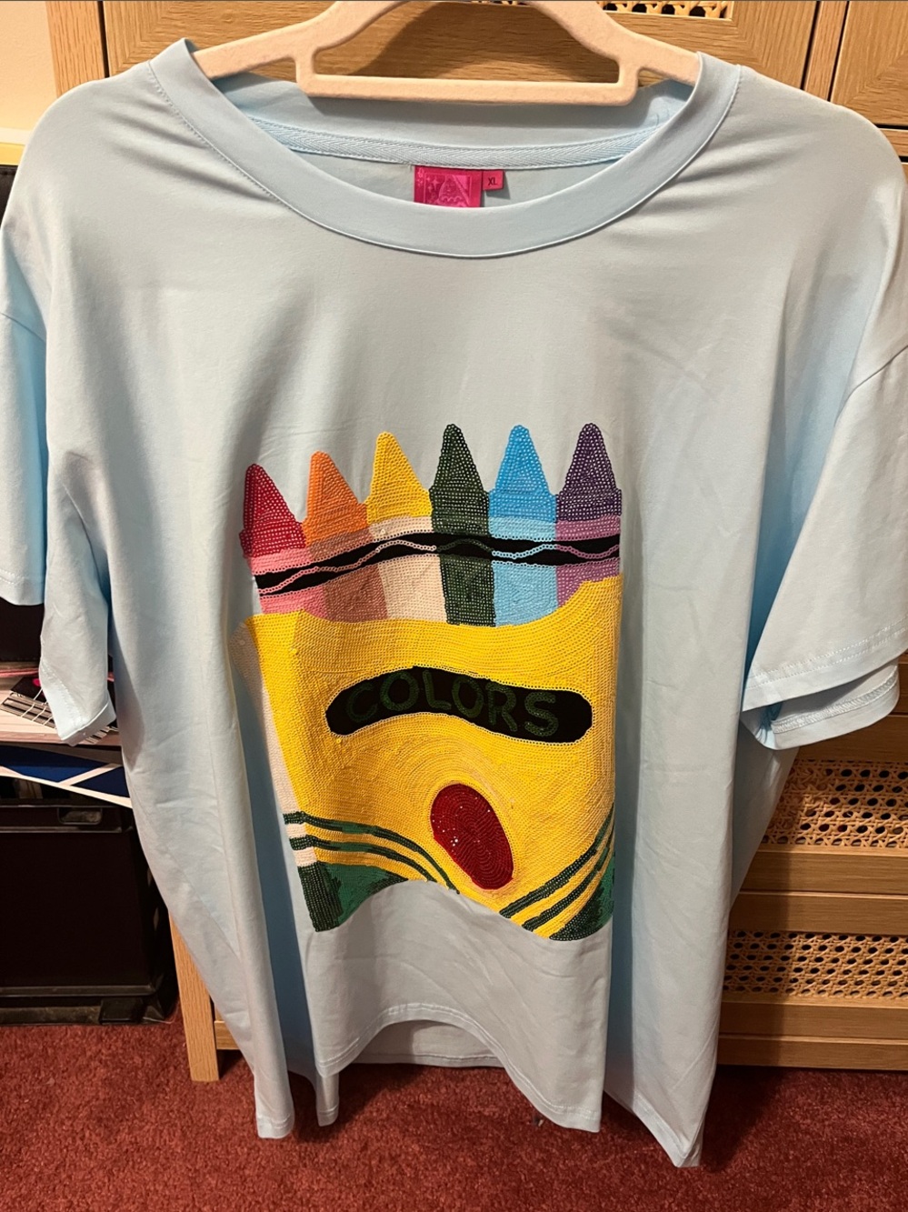 NWOT Queen of Sparkles Light Blue Graphic Tee with Colorful Crayon Design